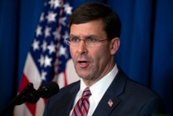 FILE - Secretary of Defense Mark Esper delivers a statement on Iraq and Syria, at President Donald Trump's Mar-a-Lago property, Dec. 29, 2019, in Palm Beach, Fla.