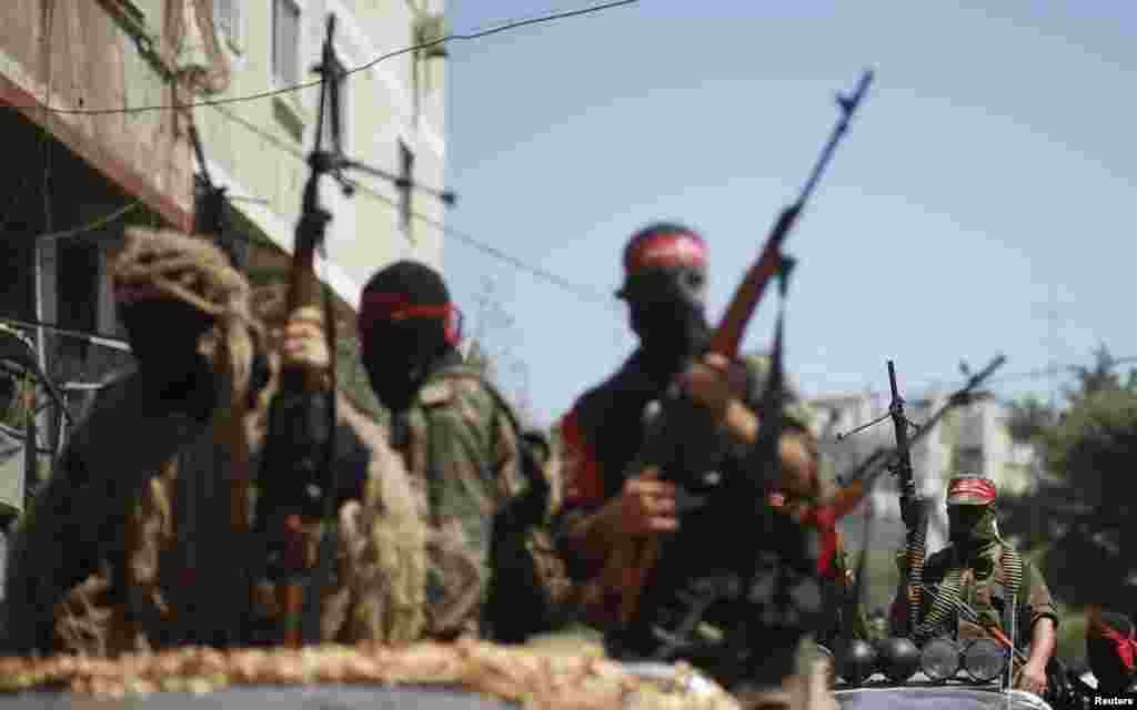 Palestinian militants from the Popular Front for the Liberation of Palestinian (PFLP) take part in a military show in Gaza City, Sept. 2, 2014.