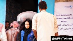 FILE - People in the Yemeni port city of Hudaydah have been provided with vouchers by the World Food Programme which they can exchange for food. (March 2019)