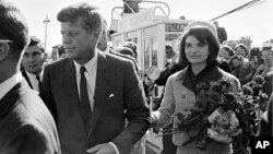 This Nov. 22, 1963 file photo shows President John F. Kennedy and his wife Jacqueline Kennedy upon their arrival at Dallas Airport shortly before President Kennedy was assassinated. 