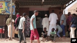 FILE - People line up in front of a bakery during a cease-fire in Khartoum, Sudan, May 27, 2023. Cholera is spreading in Sudan, killing at least 388 people and sickening about 13,000 others over the past two months.