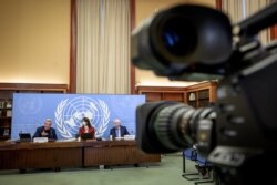 UN High Commissioner for Refugees Filippo Grandi, UN spokeswoman Alessandra Vellucci and UN Undersecretary-General for humanitarian affairs and emergency relief coordinator Martin Griffiths give a press conference in Geneva, Jan. 10, 2022.