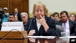 Jill Tahmooressi, mother of Marine Sgt. Andrew Tahmooressi, who has been held for six months in a Mexican jail, reads his letters from confinement, during a House Foreign Affairs subcommittee hearing on Capitol Hill in Washington, Oct. 1, 2014. 