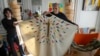 Designer Jean-Charles de Castelbajac displays a liturgical vestment for priests and to be worn at the December reopening of Paris' Notre-Dame Cathedral, Nov. 20, 2024.