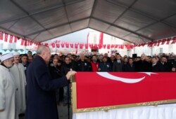 FILE - Turkey's President Tayyip Erdogan speaks during the funeralof Turkish soldier Emre Baysal, killed in Syria's Idlib region, in Istanbul, Turkey, Feb. 29, 2020.