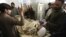 Anti-polio campaign worker Hilal Khan (C), who was shot and badly injured by unidentified gunmen, is treated at Lady Reading Hospital in Peshawar, Pakistan, Dec. 19, 2012.