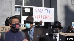 Demonstrators take part in a community rally to raise awareness of anti-Asian violence and racist attitudes, outside the Hall of Justice, San Francisco, March 4, 2021.