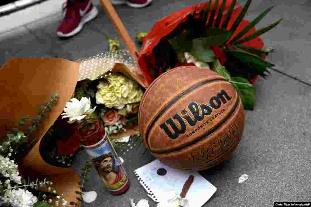 A makeshift memorial honoring former NBA basketball player Kobe Bryant appears outside of Staples center prior to the start of the 62nd annual Grammy Awards on Jan. 26, 2020, in Los Angeles.