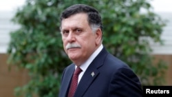 Libyan Prime Minister Fayez al-Sarraj leaves after an international conference on Libya at the Elysee Palace in Paris, May 29, 2018.