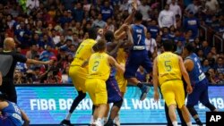 The Philippines and Australian basketball players react, during the FIBA World Cup Qualifiers Monday, July 2, 2018 at the Philippine Arena in suburban Bocaue township, Bulacan province north of Manila, Philippines. 