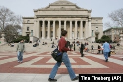 FILE - People are seen walking on the campus of Columbia University in New York on March 31, 2005. (AP Photo/Tina Fineberg)