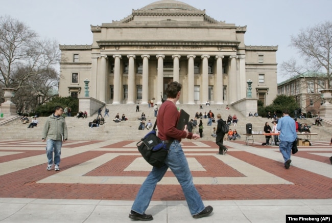 FILE - People are seen walking on the campus of Columbia University in New York on March 31, 2005. (AP Photo/Tina Fineberg)