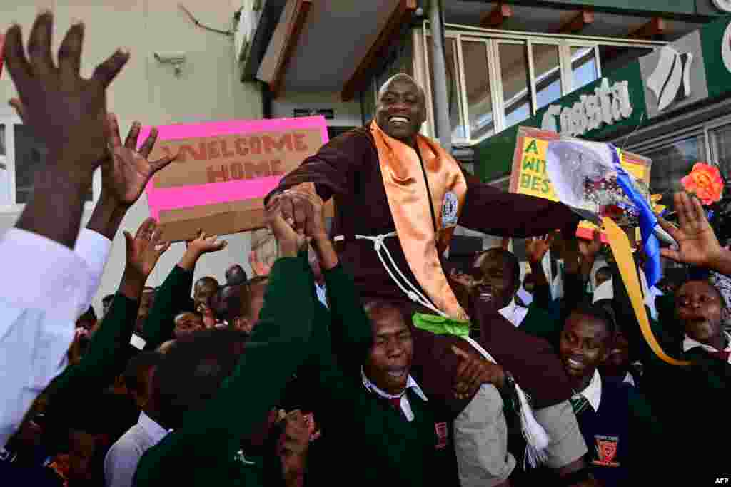 Peter Mokaya Tabichi (top), winner of the renowned Global Teacher&#39;s Prize, is welcomed by his students upon arrival at Nairobi&#39;s Jomo Kenyatta Airport in Kenya from Dubai, UAE.