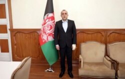 In this frame grab provided from a video by First Vice President Media office, First Vice President Amrullah Saleh stands in his office after an explosion in Kabul, Afghanistan, Sept. 9, 2020.