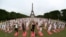 People gather for an open-air yoga session near the Eiffel tower in Paris, France.