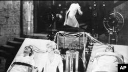 FILE - Gene Wilder, left, Teri Garr, Marty Feldman (back to camera) and Peter Boyle, right, appear in scene from movie "Young Frankenstein."