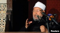 Egyptian Cleric Sheikh Yusuf al-Qaradawi, chairman of the International Union of Muslim Scholars, gives a speech during Friday prayers, before a protest against Syrian President Bashar al-Assad, at Al Azhar mosque in old Cairo, Egypt, Dec. 28, 2012.