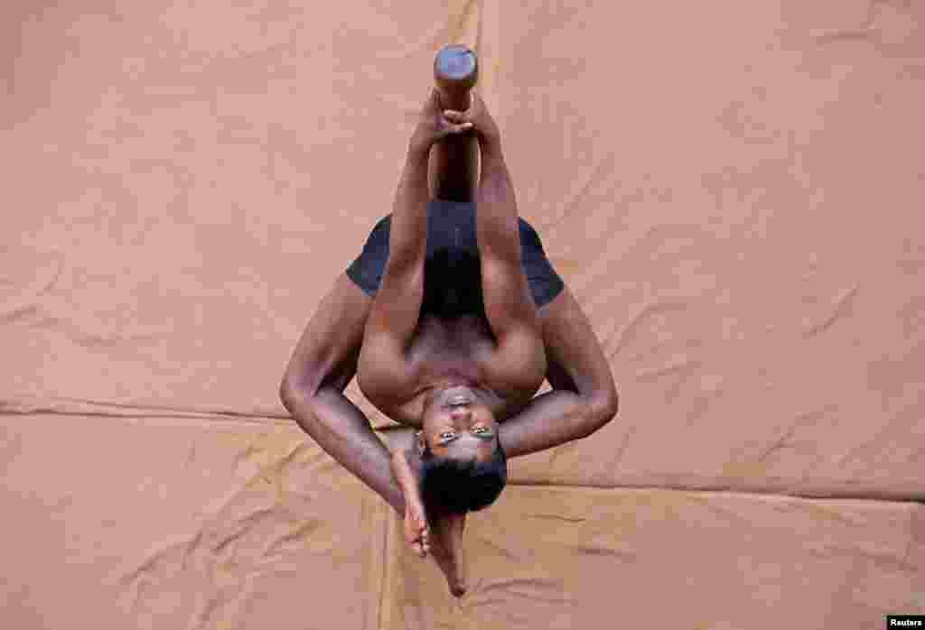A participant practices &quot;Mallakhamb&quot; (traditional Indian gymnastics) during a practice session in Ahmedabad, India.