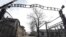 FILE - The entrance gate is seen at the Auschwitz-Birkenau Nazi concentration camp in Oswiecim, Poland, Feb. 15, 2019. The sign above the gate reads in German "Work liberates."