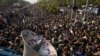 Supporters of cleric Tahir-ul Qadri listen to his speech at an anti-government rally in Islamabad, Pakistan, January 15, 2013.
