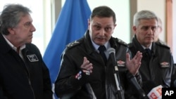 Chile's air force commander, General Arturo Merino, center, speaks during a news conference at the Chilean air force base in Punta Arenas, Dec. 12, 2019.
