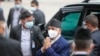 Nepal Prime Minister Khadga Prasad Oli, center, arrives at the parliament in Kathmandu, Nepal, May 10, 2021. 