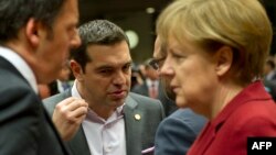 FILE - Italian Prime Minister Matteo Renzi (left), Greek Prime Minister Alexis Tsipras, European Parliament President Martin Schulz and German Chancellor Angela Merkel confer during a European Council summit in Brussels, March 19, 2015.