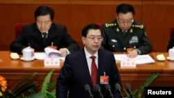 China's parliament chief Zhang Dejiang delivers a work report during the second plenary session of the National People's Congress at the Great Hall of the People in Beijing, March 8, 2015.