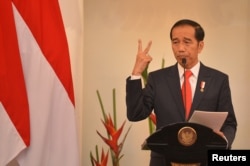 FILE - Indonesian President Joko Widodo delivers a speech at Foreign Ministry office in Jakarta, Indonesia, Feb. 12, 2018.