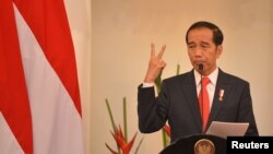 Indonesian President Joko Widodo delivers a speech at Foreign Ministry office in Jakarta, Indonesia, Feb. 12, 2018. 