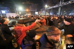 Protesters attend a rally in Almaty, Jan. 4, 2022.
