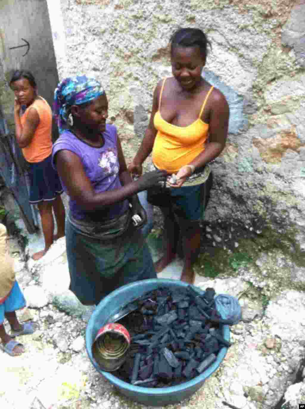 Woman buys charcoal from vendor