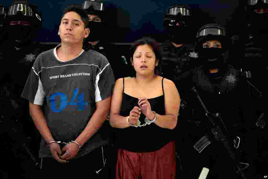 June 15: Members of the criminal kidnapping organization "Los Providencia" after their arrest on the outskirts of Mexico City June 16, 2011. (REUTERS/Jorge Dan Lopez)
