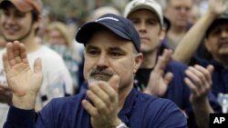 On Feb. 25, 2011, Boeing Co. workers applaud during a rally at Boeing's 767 assembly plant in Everett, Wash. The rally was held to celebrate Boeing winning a $35 billion Air Force contract.