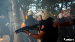 Turkish riot police enter Gezi Park at Taksim Square in Istanbul, June 15, 2013.