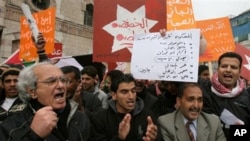 Jordanian protesters shout slogans during a protest following Friday prayers in Amman, March, 11, 2011
