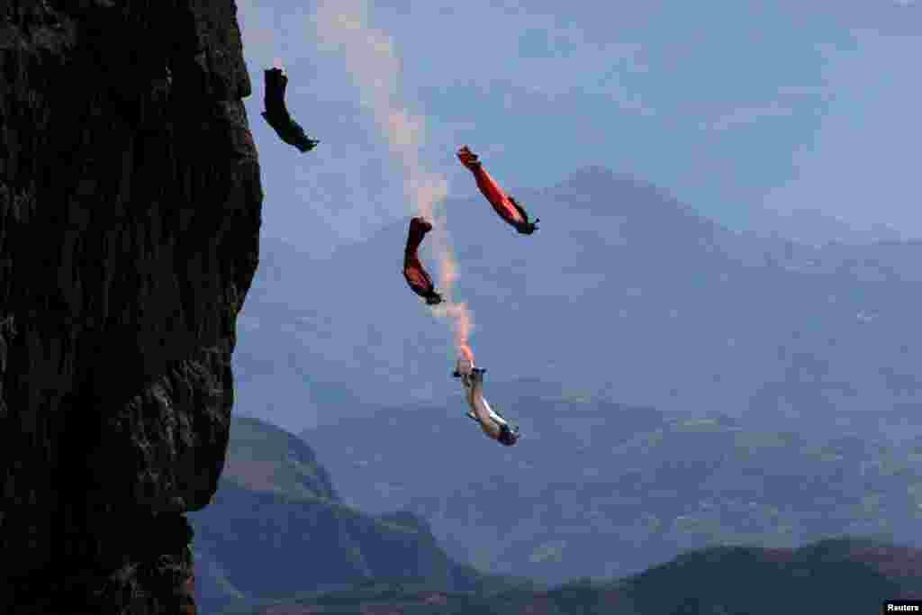 Wingsuit flyer contestants practice ahead of a competition in Zhaotong, Yunnan province, China, Nov. 4, 2015