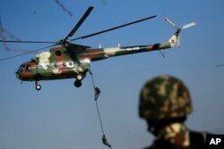 Nepalese army soldiers participate in a drill during Army Day rehearsals in Kathmandu, Nepal, March 1, 2019.