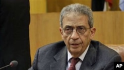 Arab League chief Amr Moussa attends the Arab League emergency meeting in Cairo, Egypt, March 12, 2011