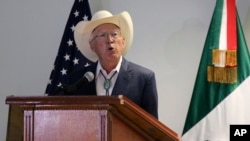 FILE - Ken Salazar, the U.S. ambassador to Mexico, speaks to the press after arriving at the Benito Juarez International Airport, in Mexico City, Sept. 11, 2021. 