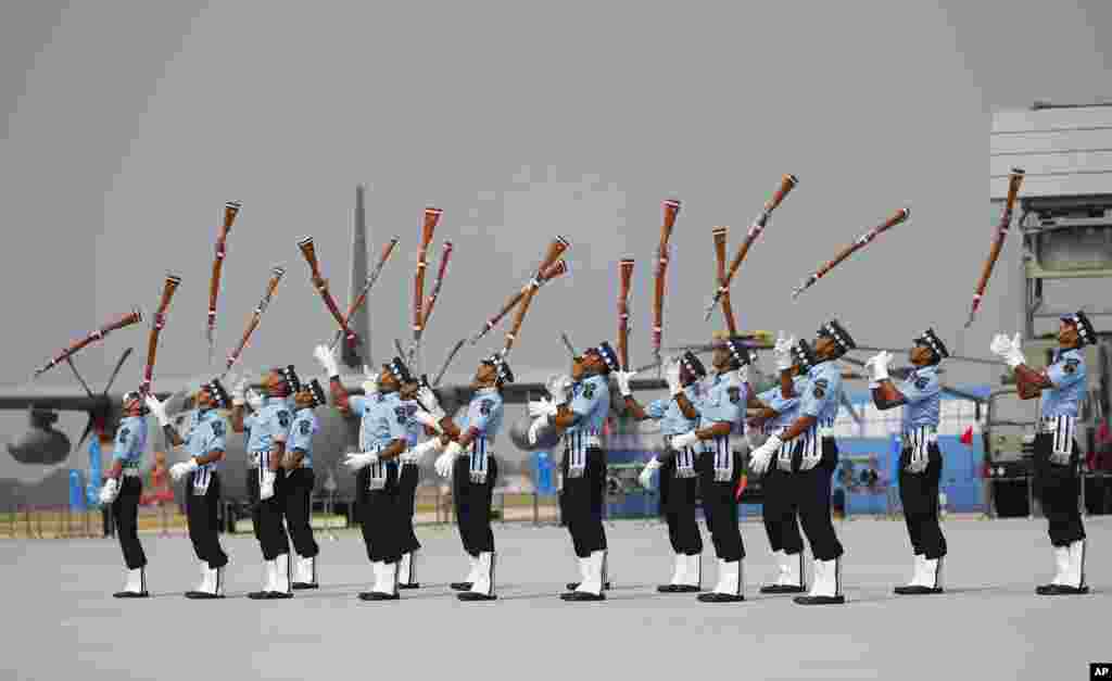 Indian Air Force (IAF) Air Warrior drill team display rifle handling skills during Air Force Day at the air force station in Hindon near New Delhi.