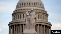 The statue of Grief and History stands in front of the Capitol Dome in Washington October 15, 2013. 