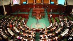 FILE - Lawmakers are seen assembled in Tunisia's parliament in Tunis, Dec. 2, 2014.