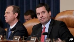 House Intelligence Committee Chairman Rep. Devin Nunes, R-Calif., and the committee's ranking member Rep. Adam Schiff, D-Calif. (left) listen on Capitol Hill in Washington, March 20, 2017, during the committee's hearing on allegations of Russian interfere