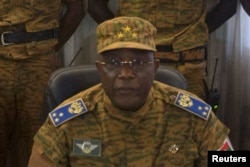 Burkina Faso's military chief General Honore Traore speaks at a news conference announcing his takeover of power, at army headquarters in Ouagadougou, Oct. 31, 2014.
