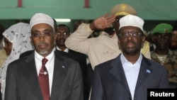 Somalia's President Sheikh Sharif Ahmed (R) and Speaker of the Parliament Sharif Hassan Sheikh Adan attend the National Constituent Assembly meeting in the capital Mogadishu, July 25, 2012. 
