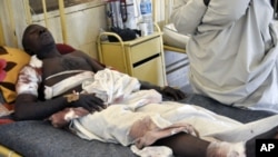 A survivor of a bomb attack rests at a hospital bed in Nigeria's northern city of Kano, January 21, 2012.