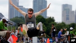 Eric Johnson competes in the men's long jump during the U.S. Paralympics Team Trials in Charlotte, N.C., July 1, 2016.