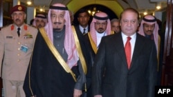 A handout photo released by the Press Information Department (PID) shows Pakistani Prime Minister Muhammad Nawaz Sharif (R) welcoming Saudi Crown Prince Salman bin Abdul Aziz Al- Saud at the Prime Minister's House in Islamabad. Feb. 17, 2014 (AFP)