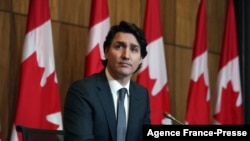 FILE - Canada's Prime Minister Justin Trudeau speaks at a news conference on the COVID-19 situation in Ottawa, Canada, Jan. 12, 2022.